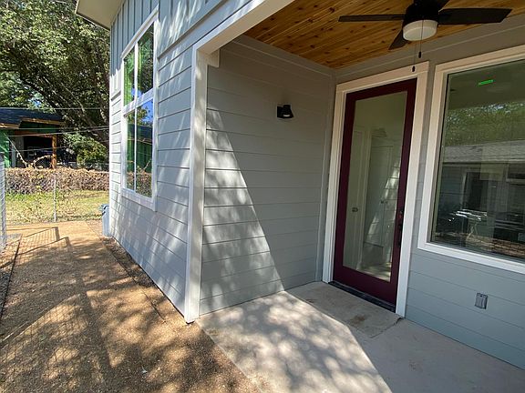 Front porch with fan and outdoor lights. Opaque film will be placed halfway on the door and window for privacy while maintaining light.