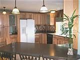 New Kitchen with Hickory Cabinets & Custom Tiled Backsplash!