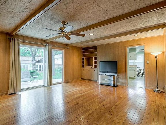 Spacious family room with hardwoods and built ins