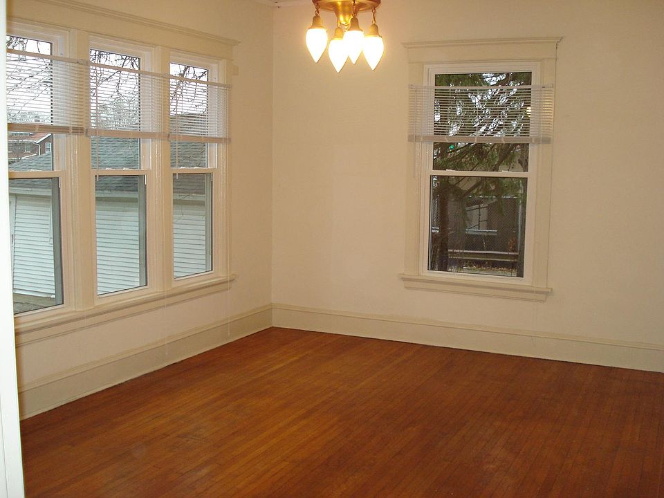 dining room with hardwood floor, antique ceiling fixture