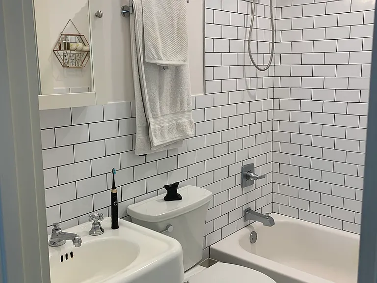 Hall bath with vintage pedestal sink