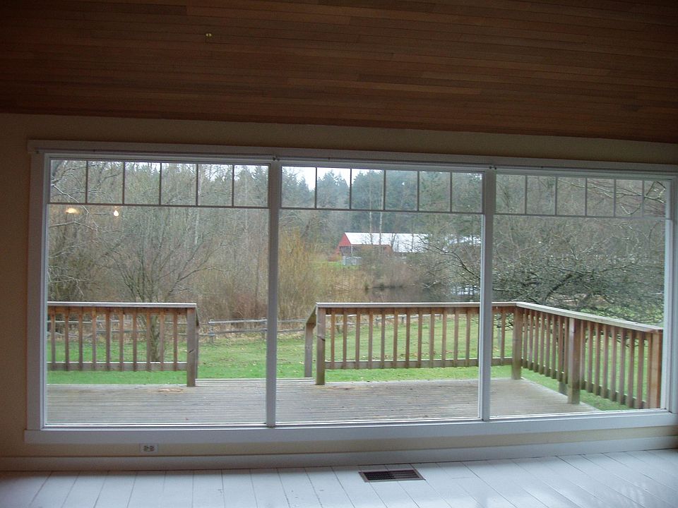 view from living room overlooking deck and pond  