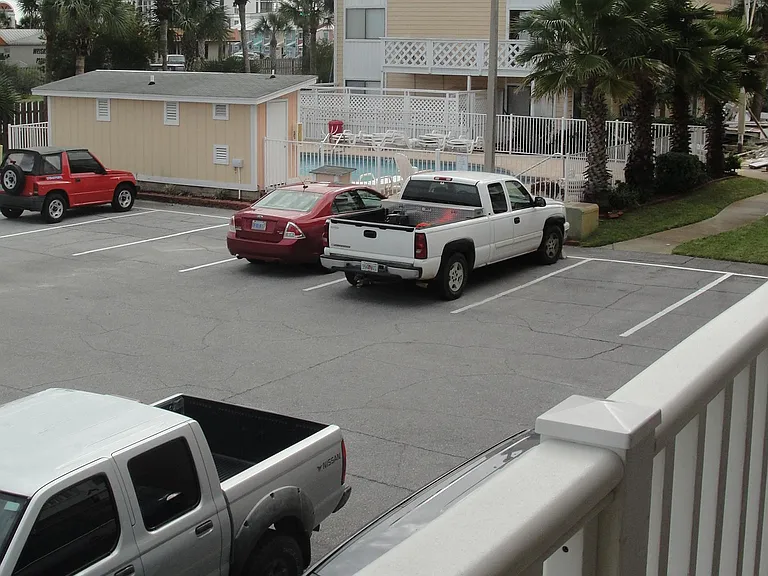 View from your balcony to the community pool! 50 steps to the beach!