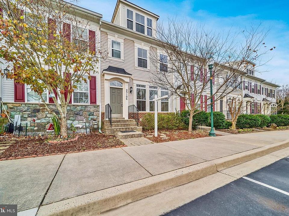 Front Entrance with 2 assigned parking spots and guest parking close by