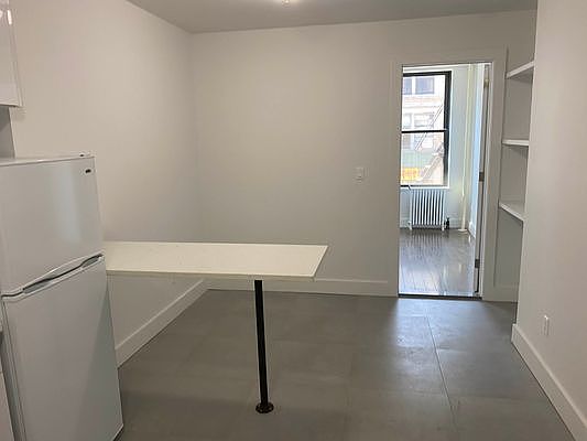 2nd image of 64 E Broadway #4