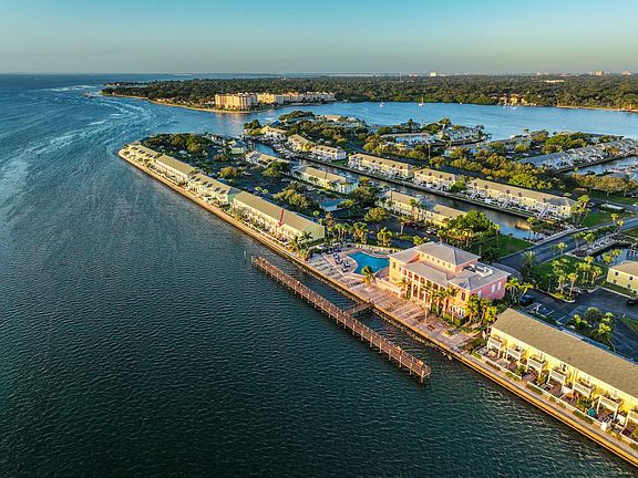 Aerial View. Arrow showing where townhouse is in proximity to the pool and Yacht Club.