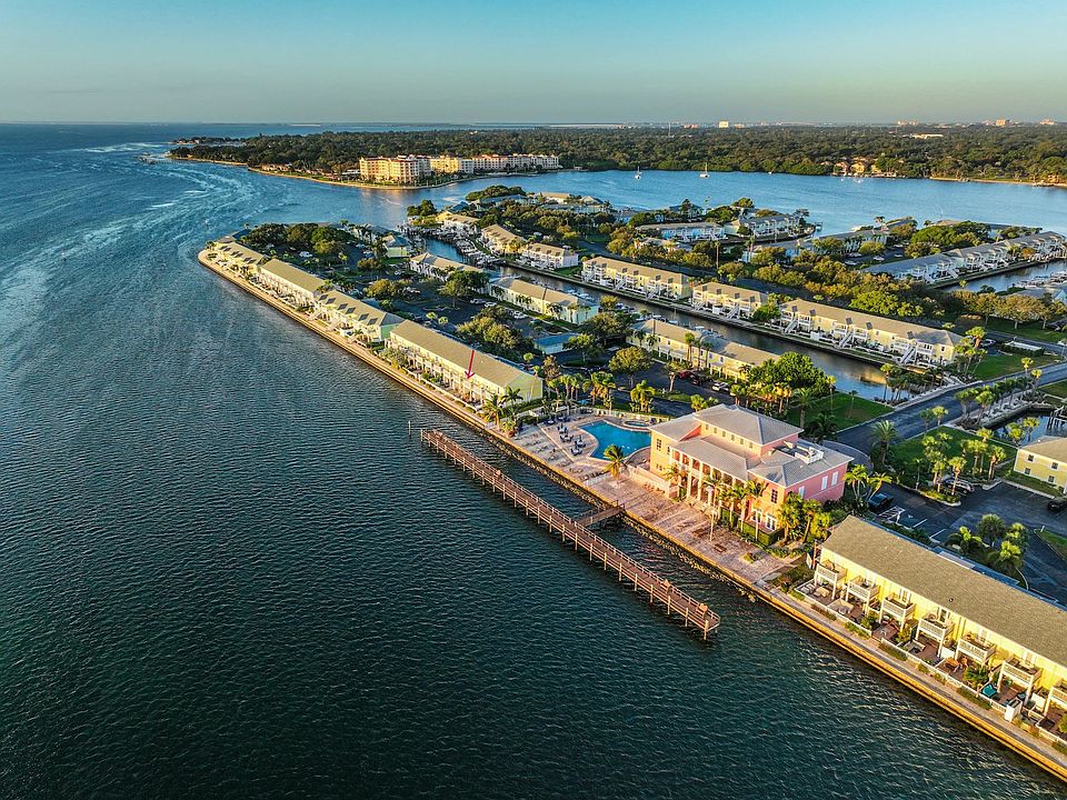 Aerial View. Arrow showing where townhouse is in proximity to the pool and Yacht Club.