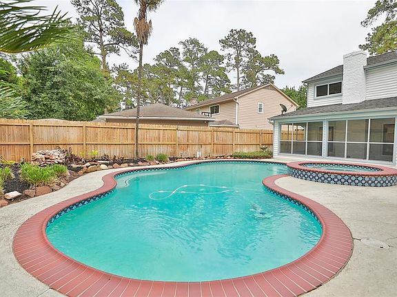 The lovely yard has new fencing and easy to maintain landscaping