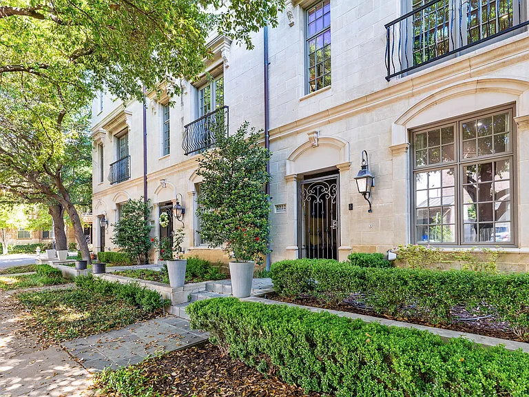 Sophisticated townhome living with timeless architectural charm.