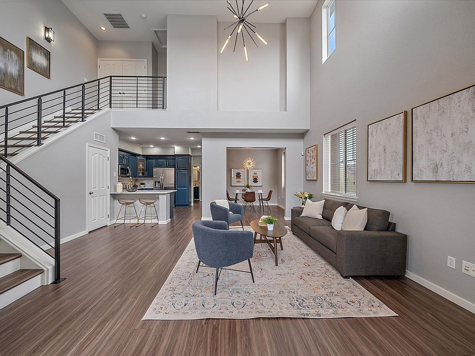 Gorgeous main floor living space with high vaulted ceilings (no longer staged)