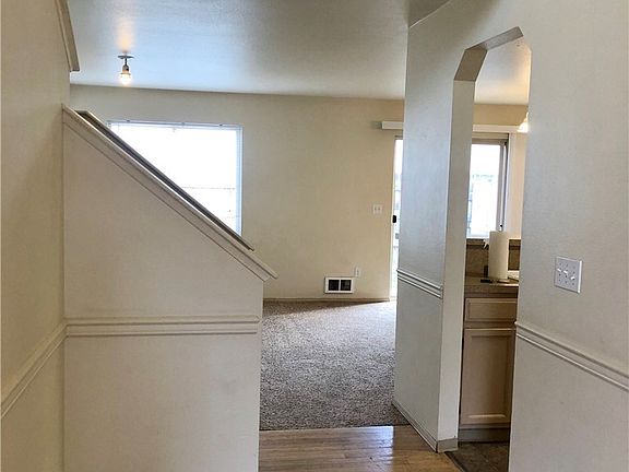 Entry looking toward kitchen, living room, sliding door to backyard. All living area on first floor, 3 bedrooms upstairs. 