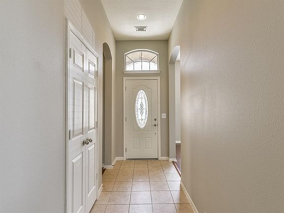 Tiled entry way greets you home and light and bright colors fill the space.  Good size coat closet near the front door for easy store away of shoes, coats and bags.