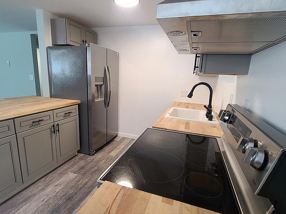 New high end stainless appliances and new cabinets with soft close doors in the kitchen.