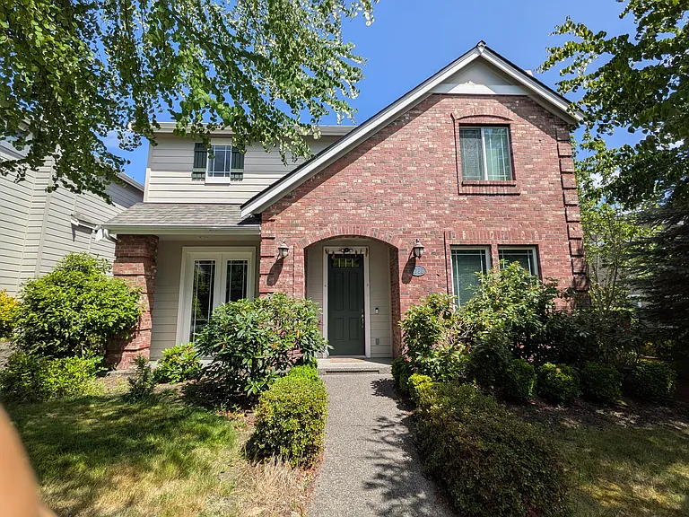 West facing entrance; pear trees on the sound facing yard.
