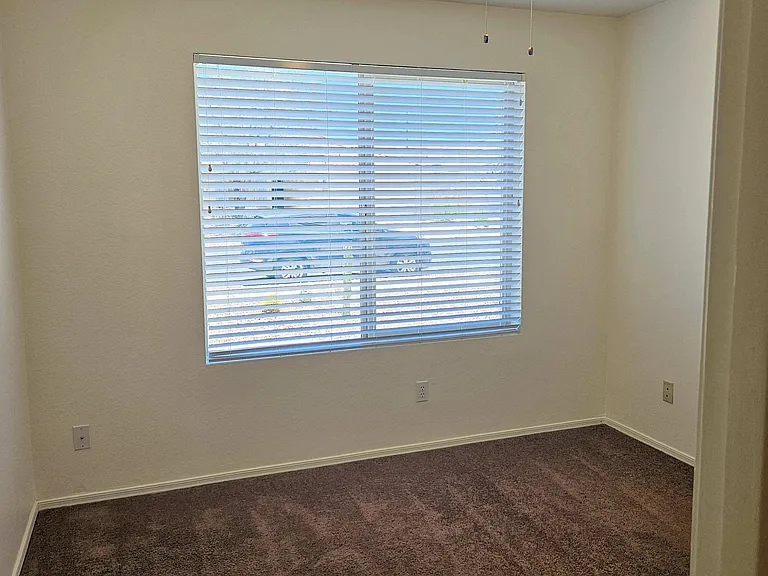Front bedroom with ceiling fan