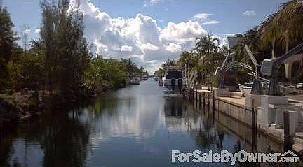 Private cul-de-sac canal view!
						:
						Boat parking for two, no boats or lifts across from house for easy boat parking!