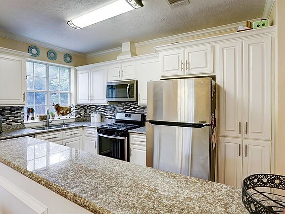 There is lots of cabinet space in the kitchen which is open to the dining room and the family room.