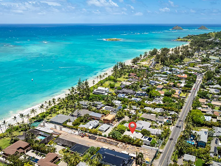 Aerial view of the property and surrounding Kailua Beach coastline with the Mokulua Islands in the distance.