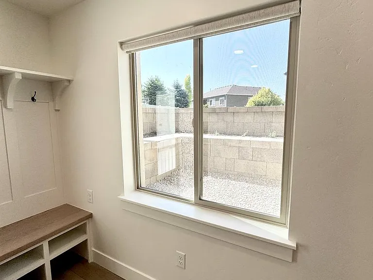 Large ground level window out to backyard. Lots of light