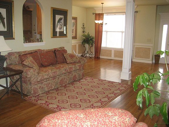 Open Floor Plan w/Extra Details such as Arched Pass-Through Window & Columns