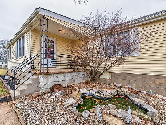 Front porch overlooking small pond