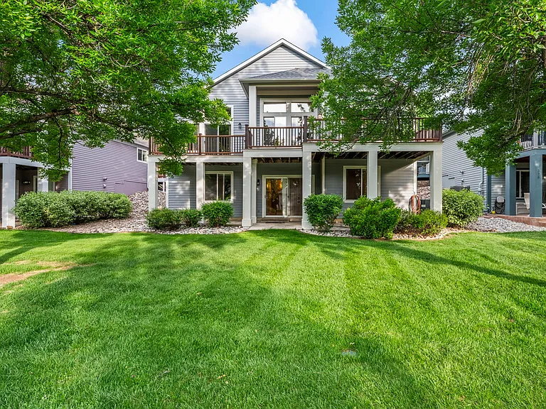 View from the West of the Property with lower level walk out and upper deck.