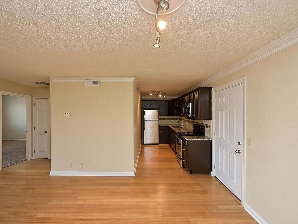 Explore the charm of this contemporary apartment featuring a stylish kitchen and inviting living area.