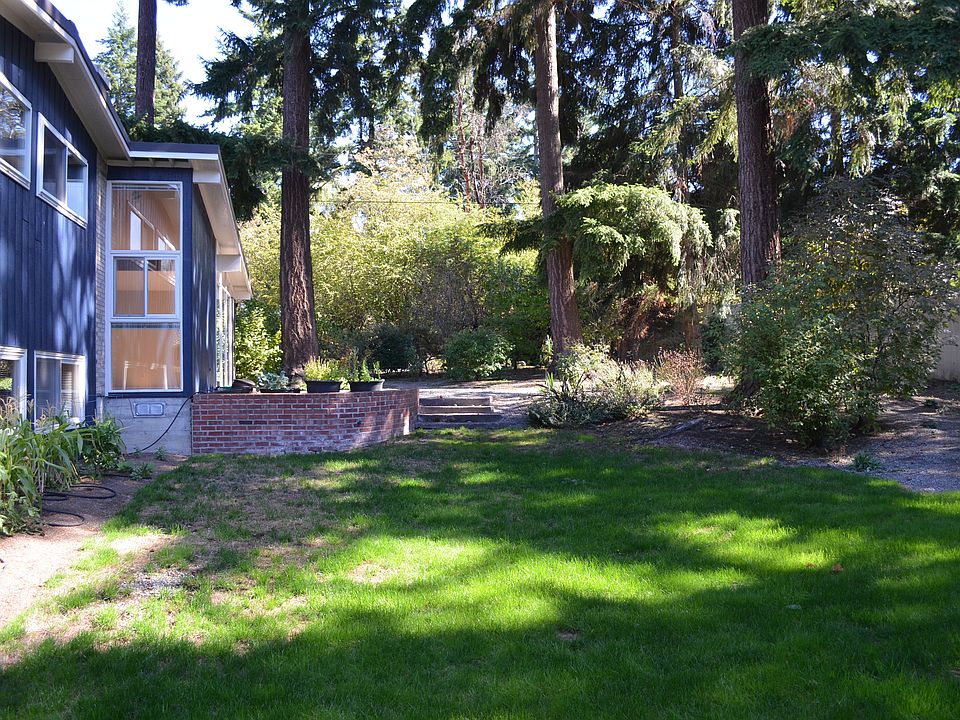 Large backyard with patio provides entertaining space and ro