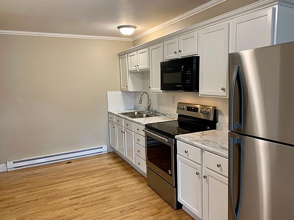 Brand new kitchen, including new cabinets, countertop, appliances and subway tile backsplash
