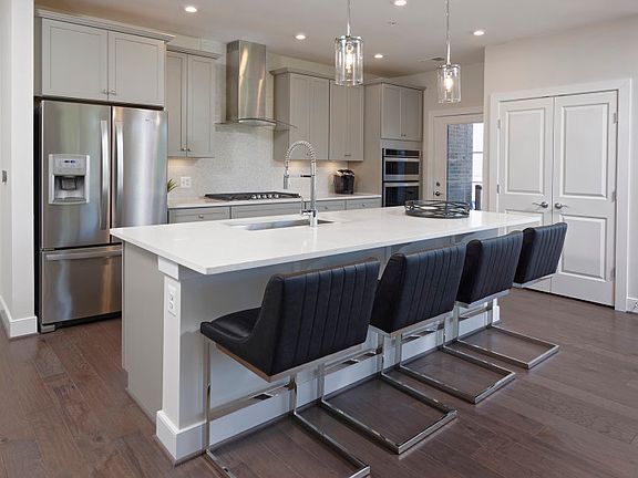 Model Representation - Enjoy entertaining friends in your beautiful kitchen in the Ava condo.