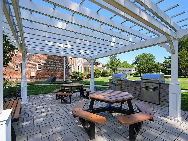 Elevate your outdoor gatherings at Eagle Rock Apartments at Woodbury. Enjoy a beautifully designed patio with picnic tables and modern grills, perfect for BBQs and relaxation. Immerse yourself in community livingschedule a visit today!