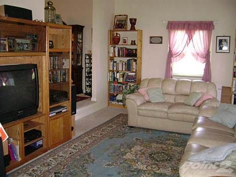 Living Room with catherdal ceiling