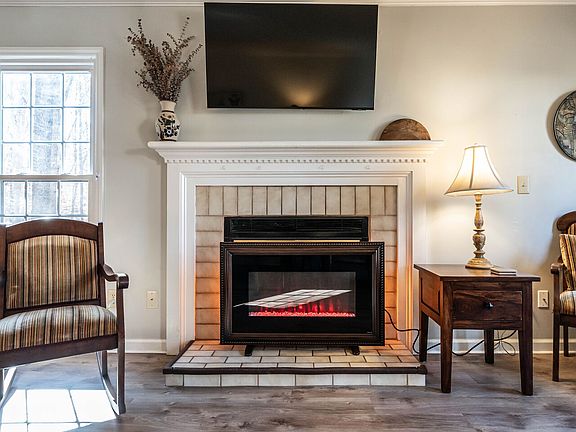 55"Samsung Smart TV centrally located but not necessarily at the center with the way this room is set for connecting