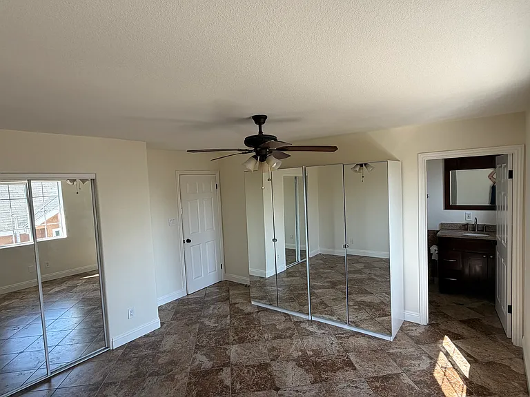 Master bedroom with private bathroom. Two mirrored wardrobe/storage cabinets are currently available and may be left for the next tenant's use or removed upon request.