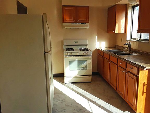 Kitchen with gas range, large refrigerator, garbage disposal, lots of storage