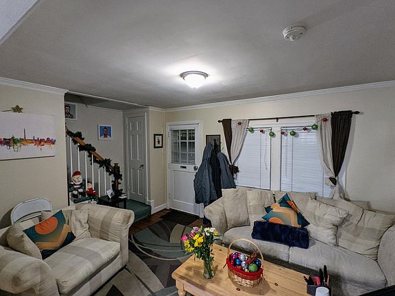 Living room with view of stairs