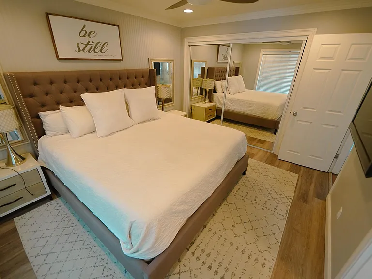 Master bedroom with Large closet, king bed, large nightstands and smart TV along with ensuite bath