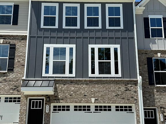 Front of the house, two car garage and an extended drive way