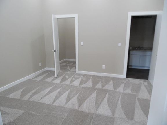 Bedroom showing closet and bathroom entrance. Bathroom also off hall, so can keep bedroom private.