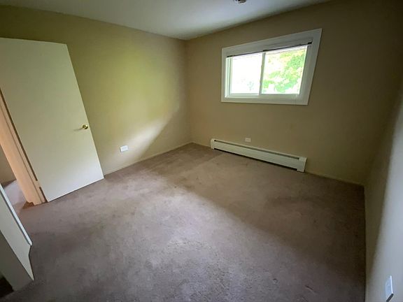 Corner second bedroom features large double closet.