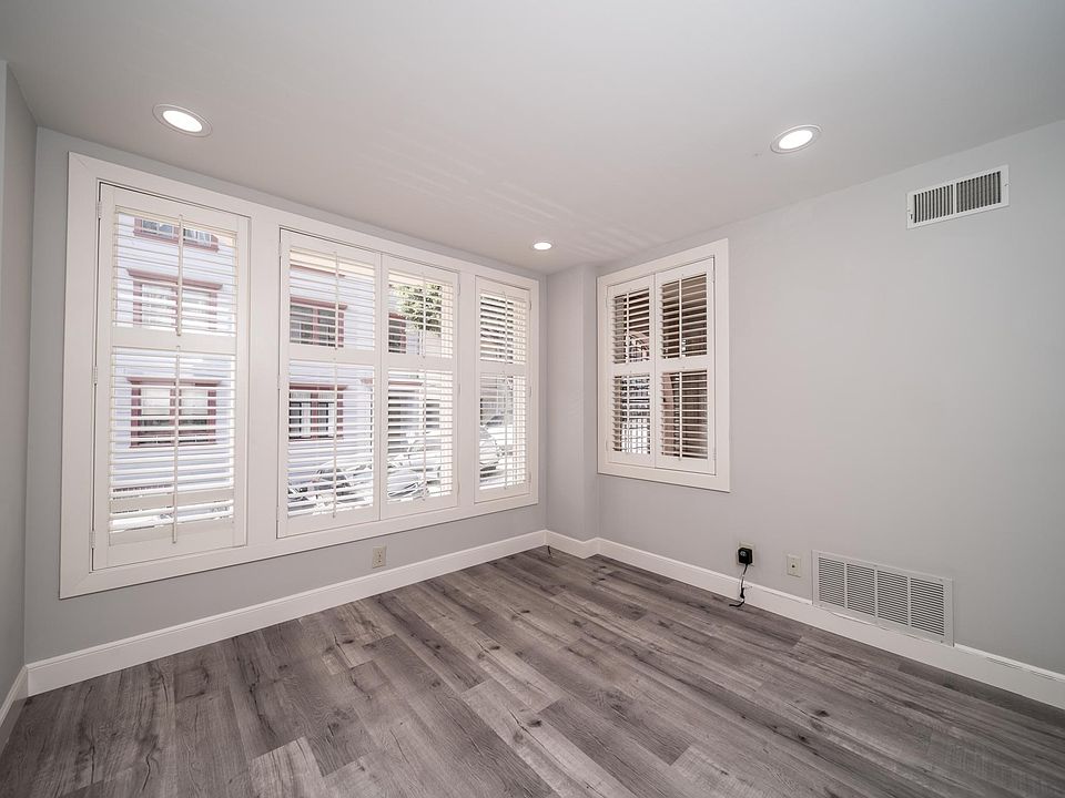 Light-filled bedroom with plantation shutters for privacy