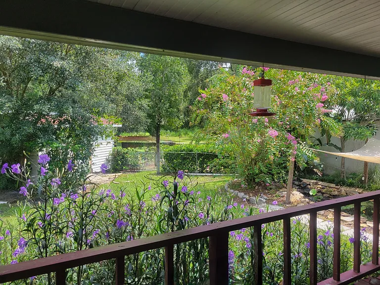 Large 20 x 20 covered patio that over looks 1.3 acres of land with fully stocked Koi Pond and fenced yard that backs up to woods.