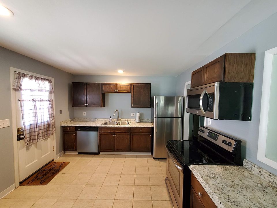 Updated kitchen with new cabinets and stainless steel appliances