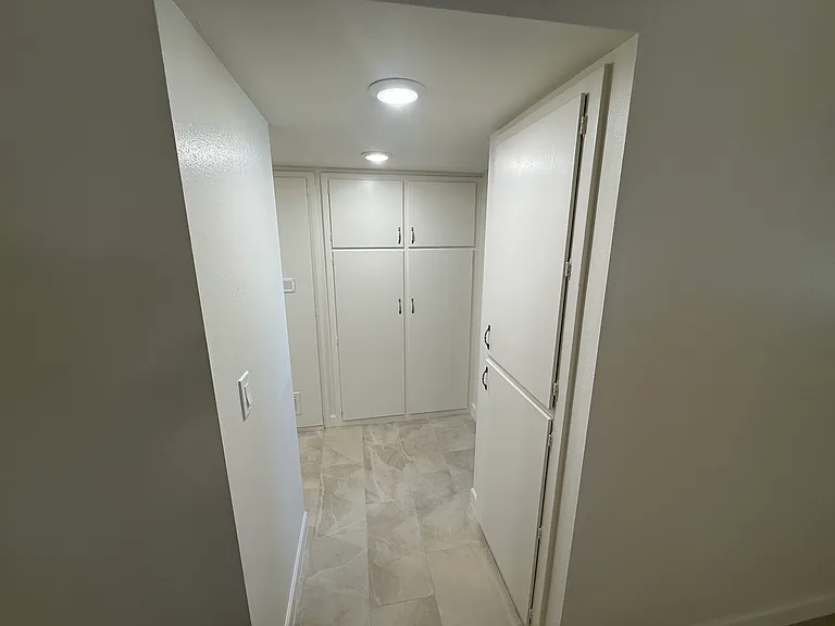 Light & Bright Hallway with lots of cabinets