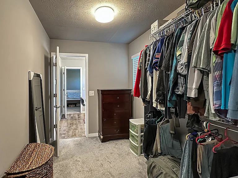 Primary Bedroom Closet Adjoins Laundry Area