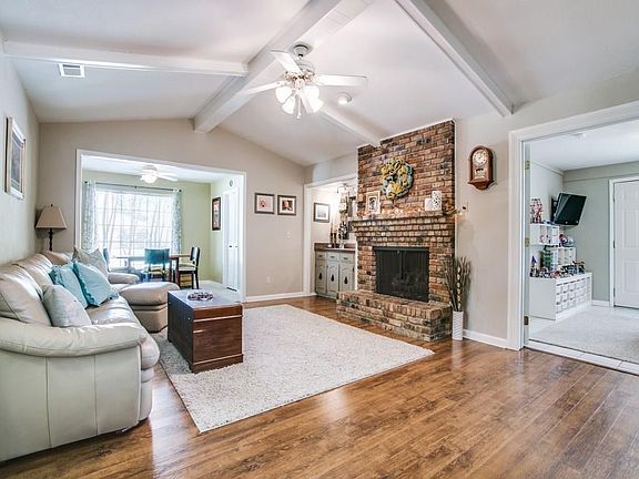 Updated wet bar, charming gas fireplace, and vaulted ceilings. The homeowners removed all of the popcorn texture throughout the entire home!