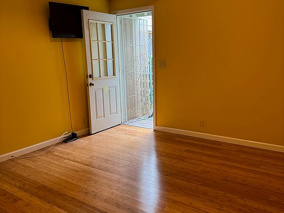 Smaller bedroom with a door to back garden