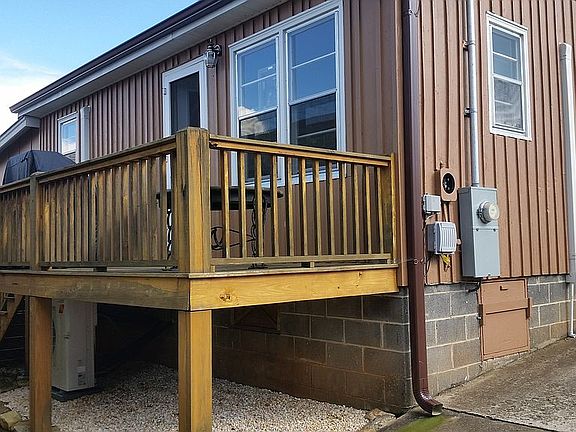 deck on back of small house