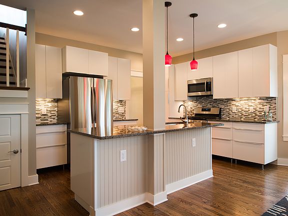 Clean, sleek, white kitchen