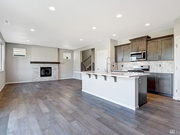 Kitchen, Dining, Great Room View - photos of another Plan 2581 in community. Colors will vary